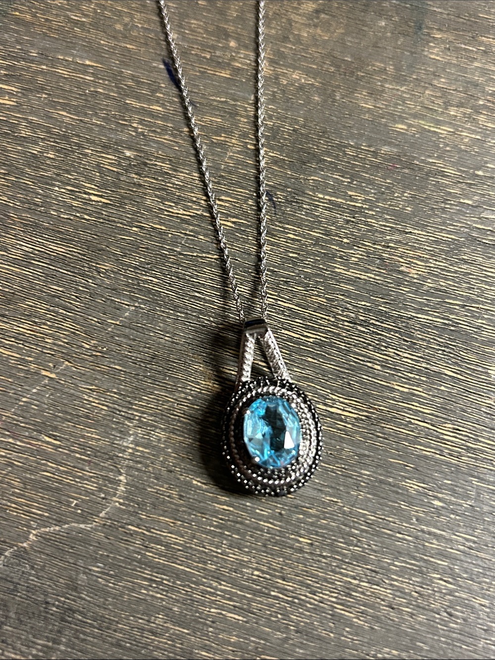 Blue Topaz with black diamond accents sterling silver necklace